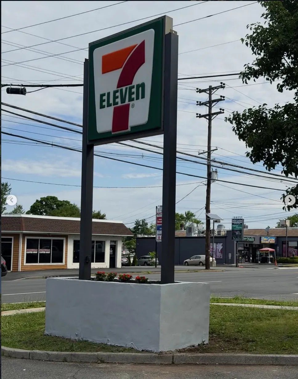 Wide view — sign stabilized and safe pending full replacement