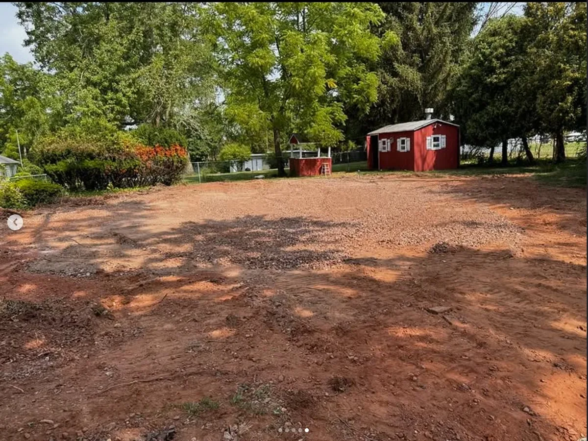 Graded hardscape-ready site after pool removal
