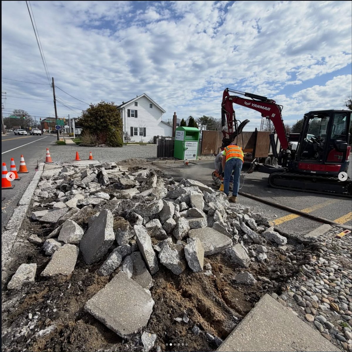 Demolition — breaking out the failed slab with the mini excavator