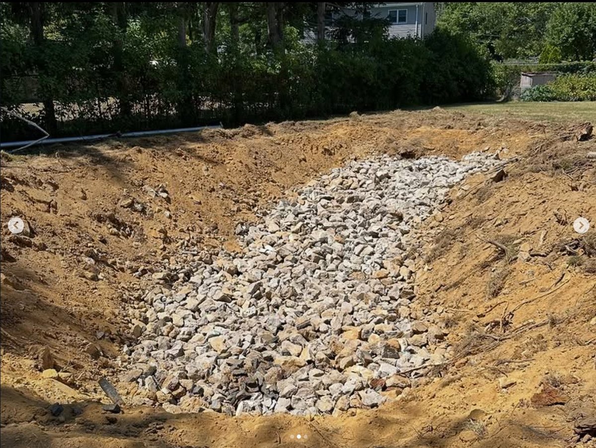 Backfill — clean broken concrete and fill placed and compacted in lifts