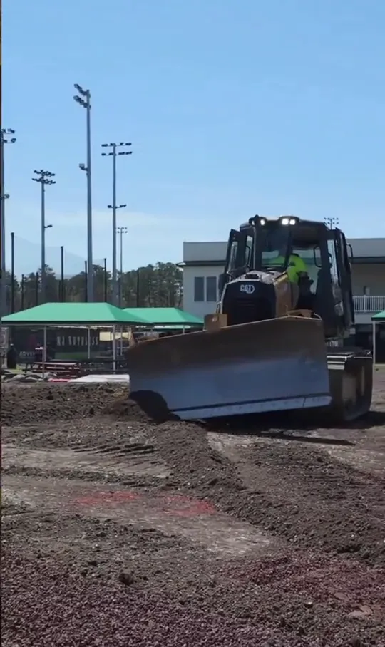 CAT dozer spreading stone base at Adventure Crossing USA in Jackson, NJ